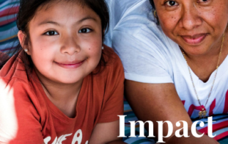 GAIN Impact Report 2022. Background image is of a smiling Latina woman and young girl laying on top of a colorful towel in the grass.